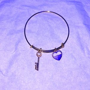 Bracelet, heart key on it , color is gold